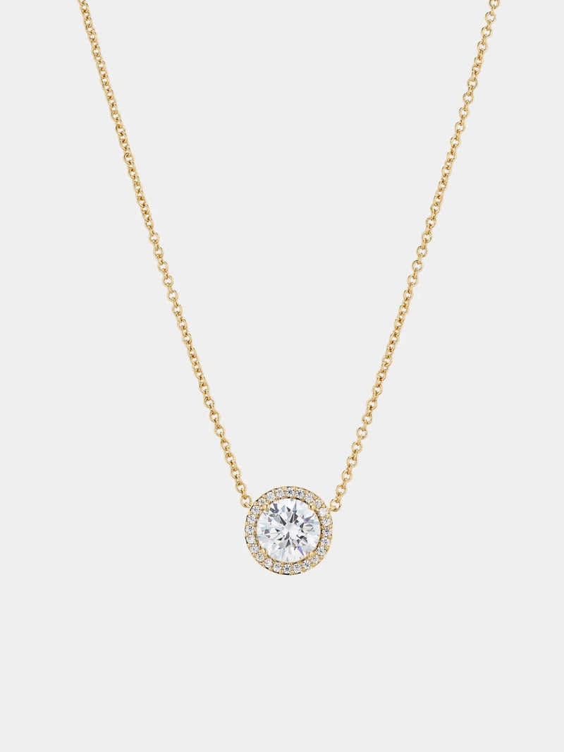 Solitair diamond necklace with small stones around 
